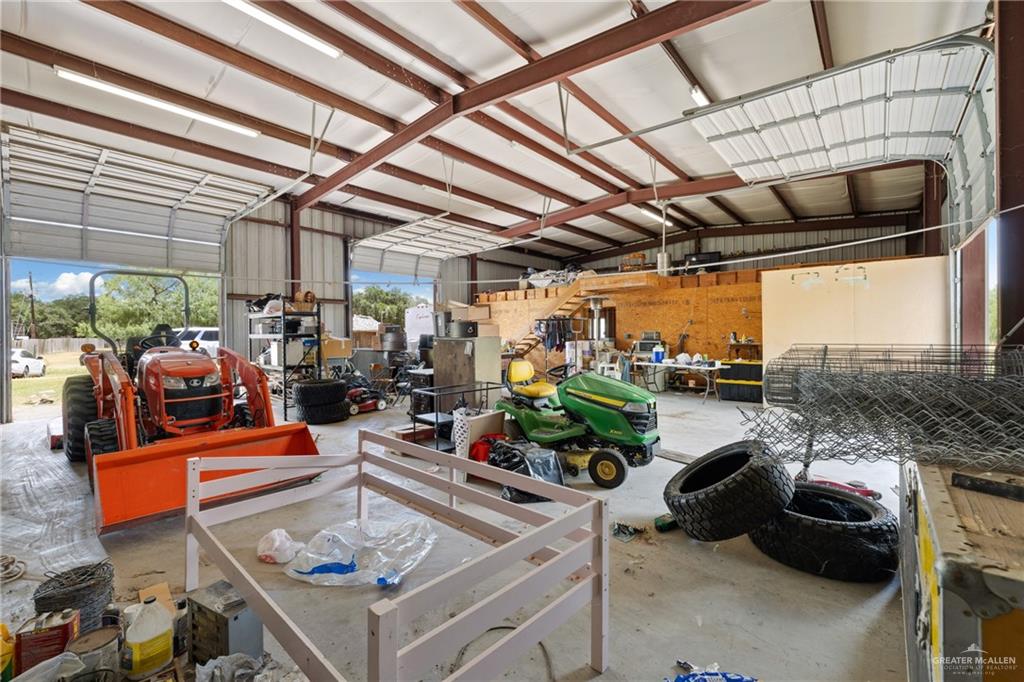 10612 North Ware Road McAllen, TX 78504 - Photo 13 of 20 a view of a patio with table and chairs potted plants and floor to ceiling window