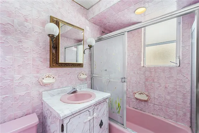 a kitchen with a sink cabinets and window