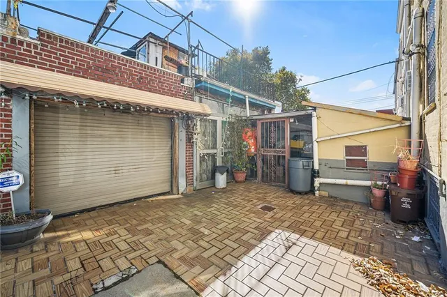 a view of a street that has couple of cars parked on the road