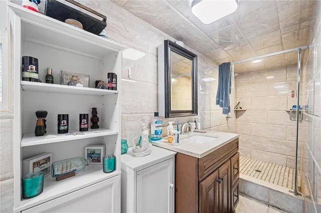 a large kitchen with stainless steel appliances granite countertop a sink stove and refrigerator