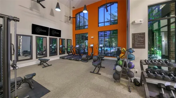 a view of living room with gym equipment