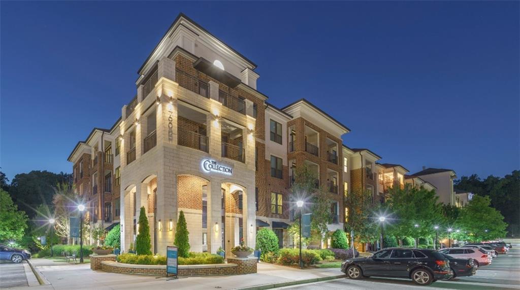 4600 Roswell Road, Unit 666 Sandy Springs, GA 30342 - Photo 18 of 22 a view of a tall building next to a road