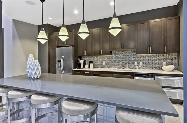 a kitchen with a table and chairs in it