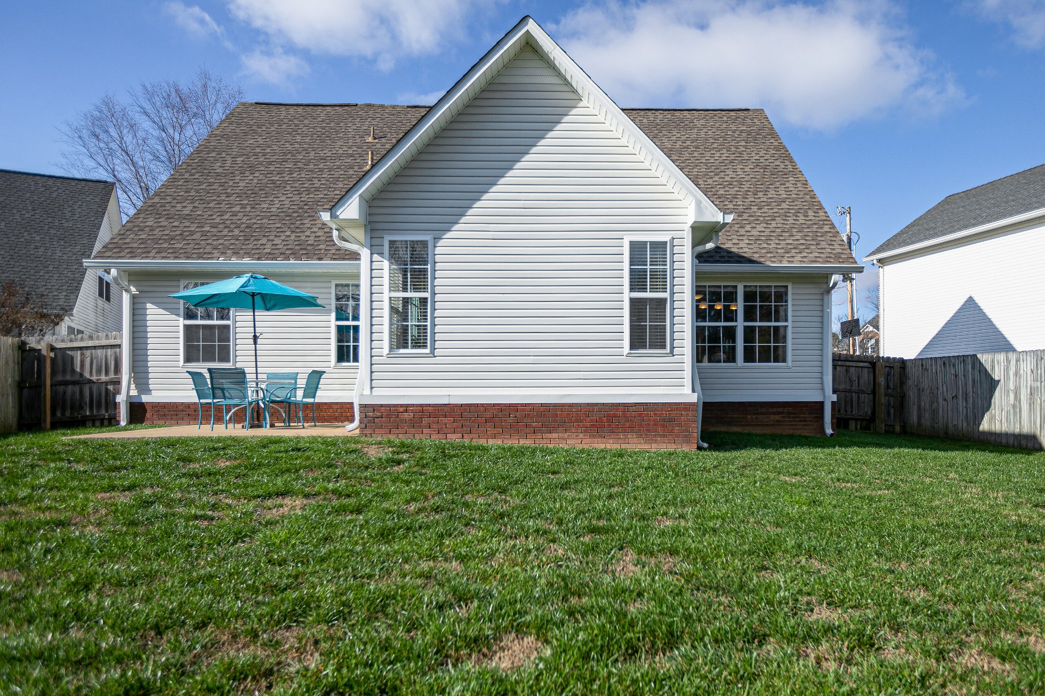 303 Cheairs Court Spring Hill, TN 37174 - Photo 20 of 23 a view of a house with a yard and sitting area