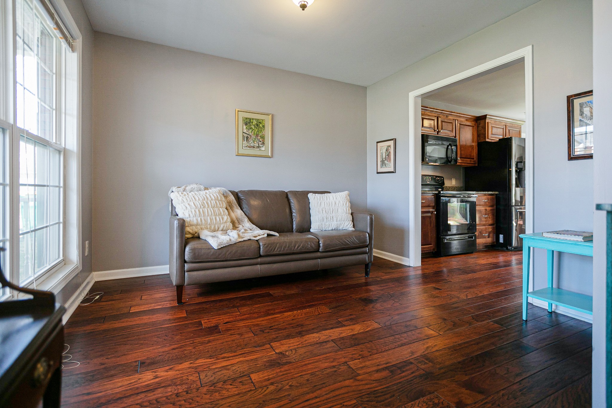 303 Cheairs Court Spring Hill, TN 37174 - Photo 4 of 23 a living room with furniture and a flat screen tv