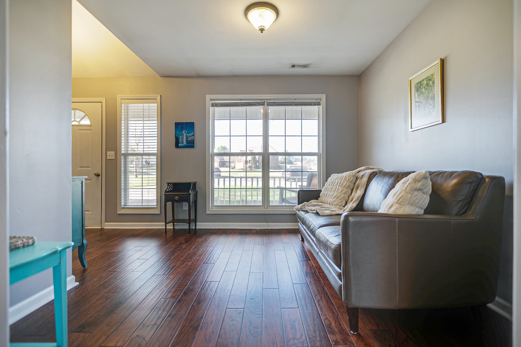 303 Cheairs Court Spring Hill, TN 37174 - Photo 5 of 23 a view of a livingroom with wooden floor and a window