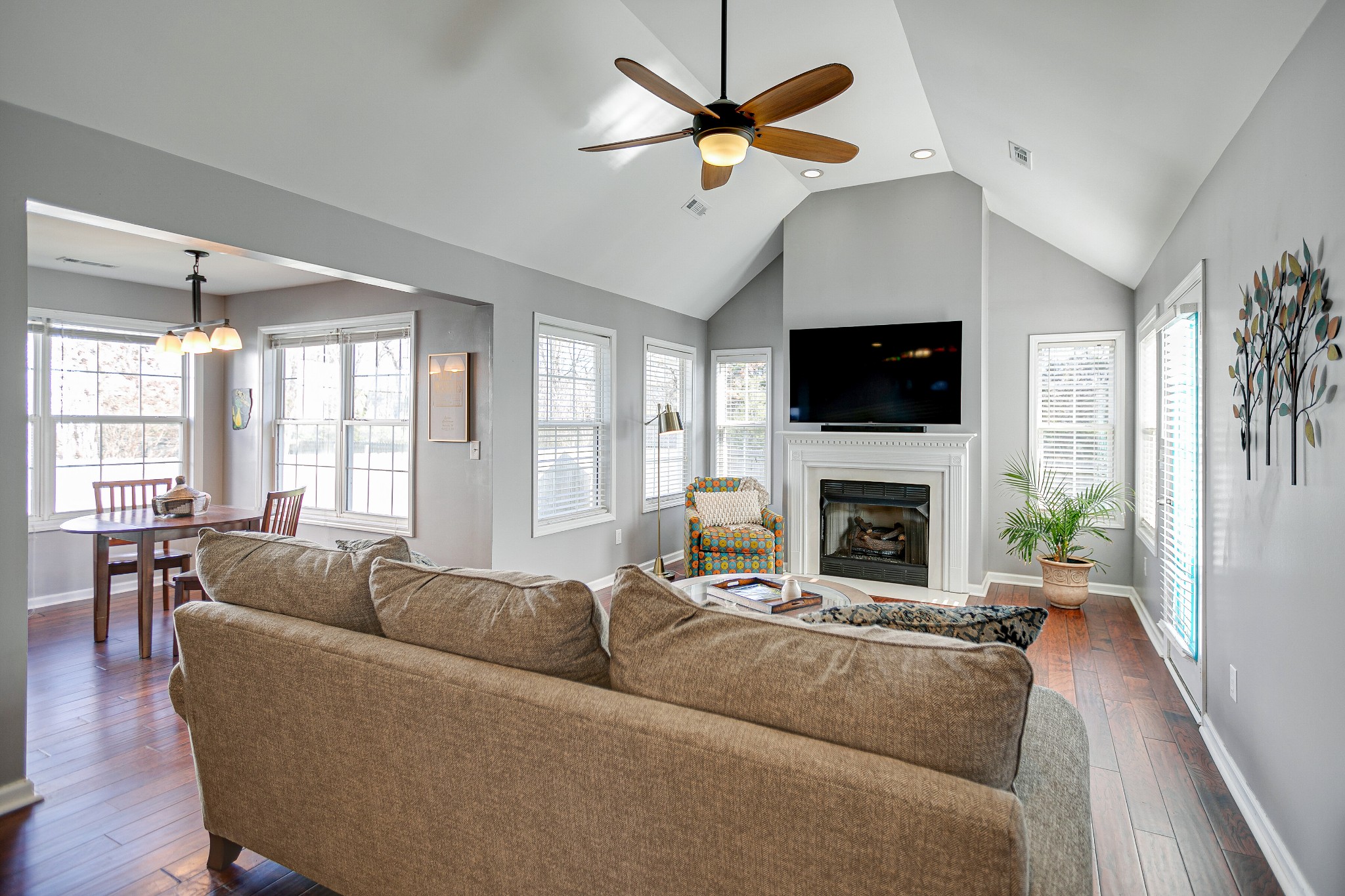 303 Cheairs Court Spring Hill, TN 37174 - Photo 9 of 23 a living room with furniture a fireplace and a flat screen tv