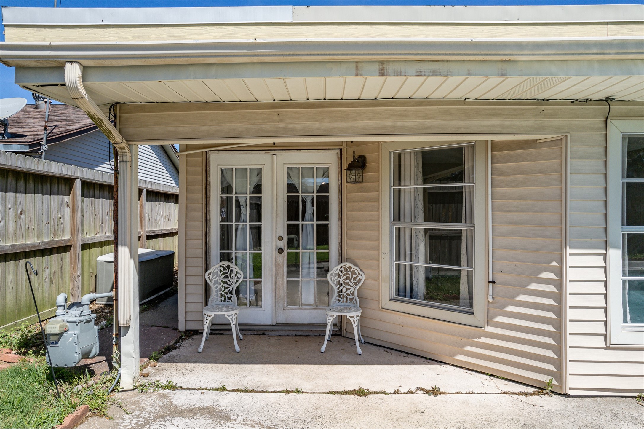 1603 East Baker Road Baytown, TX 77521 - Photo 23 of 26 This photo features a covered patio area with French doors leading inside,