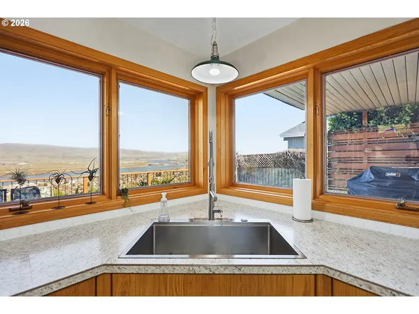 a view of a living room and floor to ceiling window