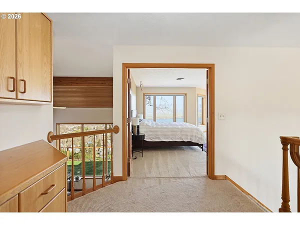 a view of a bedroom from a corridor