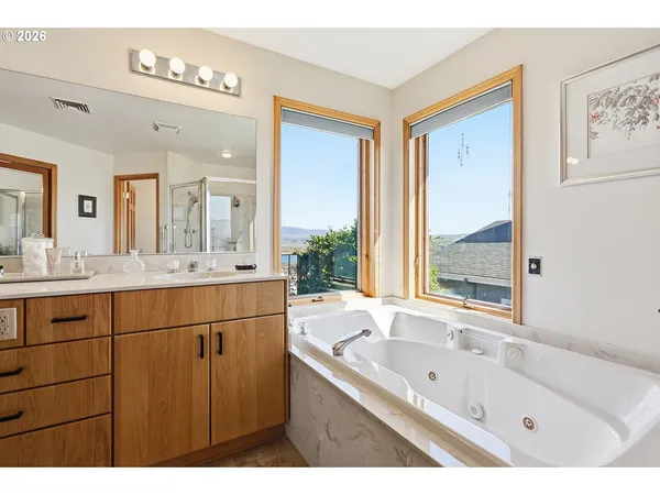 a bathroom with a shower and a sink