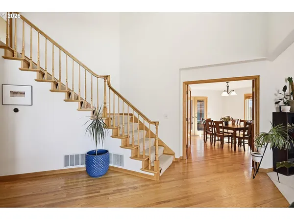 a view of entryway and dining room with furniture