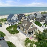 an aerial view of a house with a ocean view