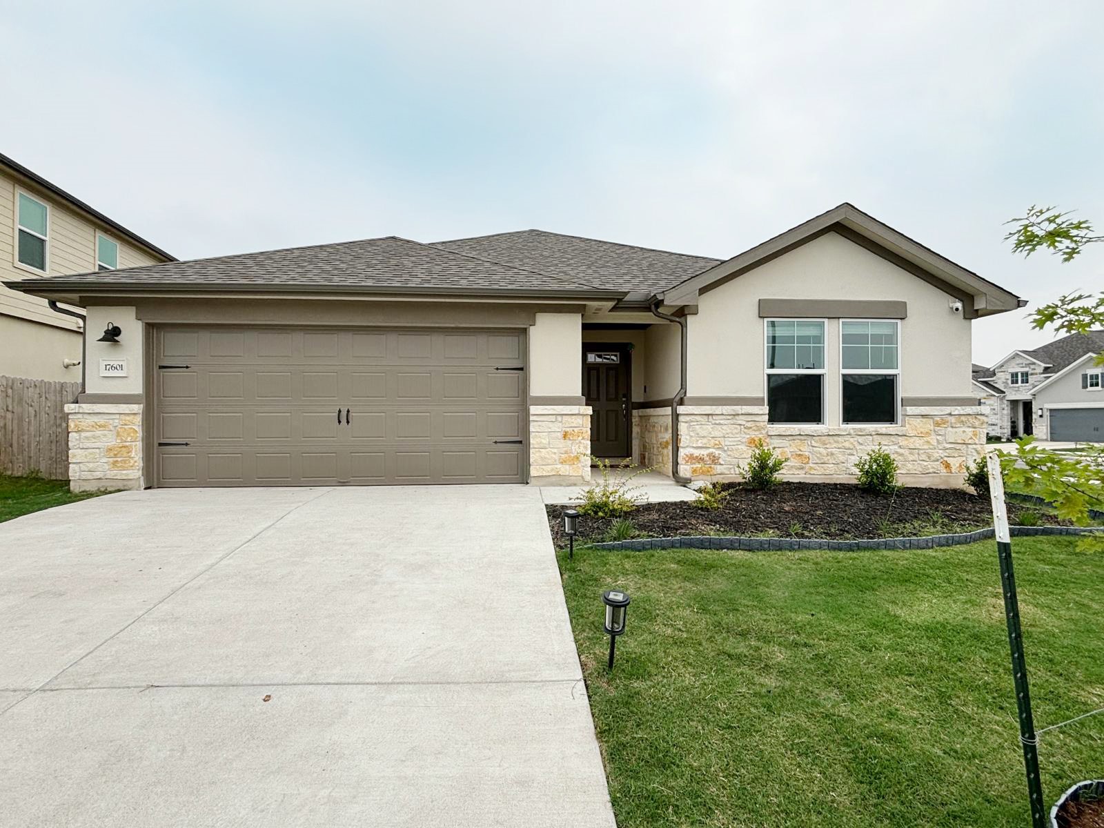 17601 Owl Tree Road Manor, TX 78653 - Photo 1 of 1 a house view with a garden space
