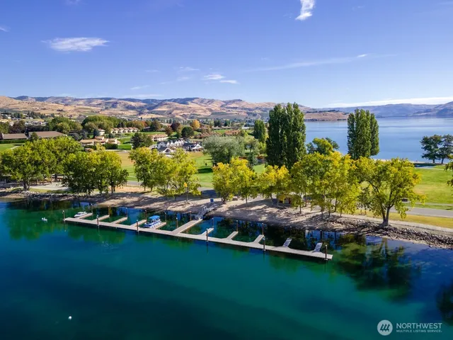 a view of a lake with houses in the back