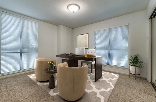 a dining room with furniture and window