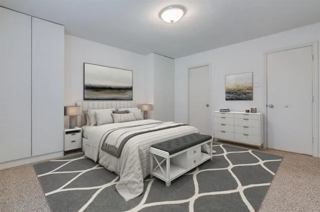 a bedroom with a bed and a view of bathroom