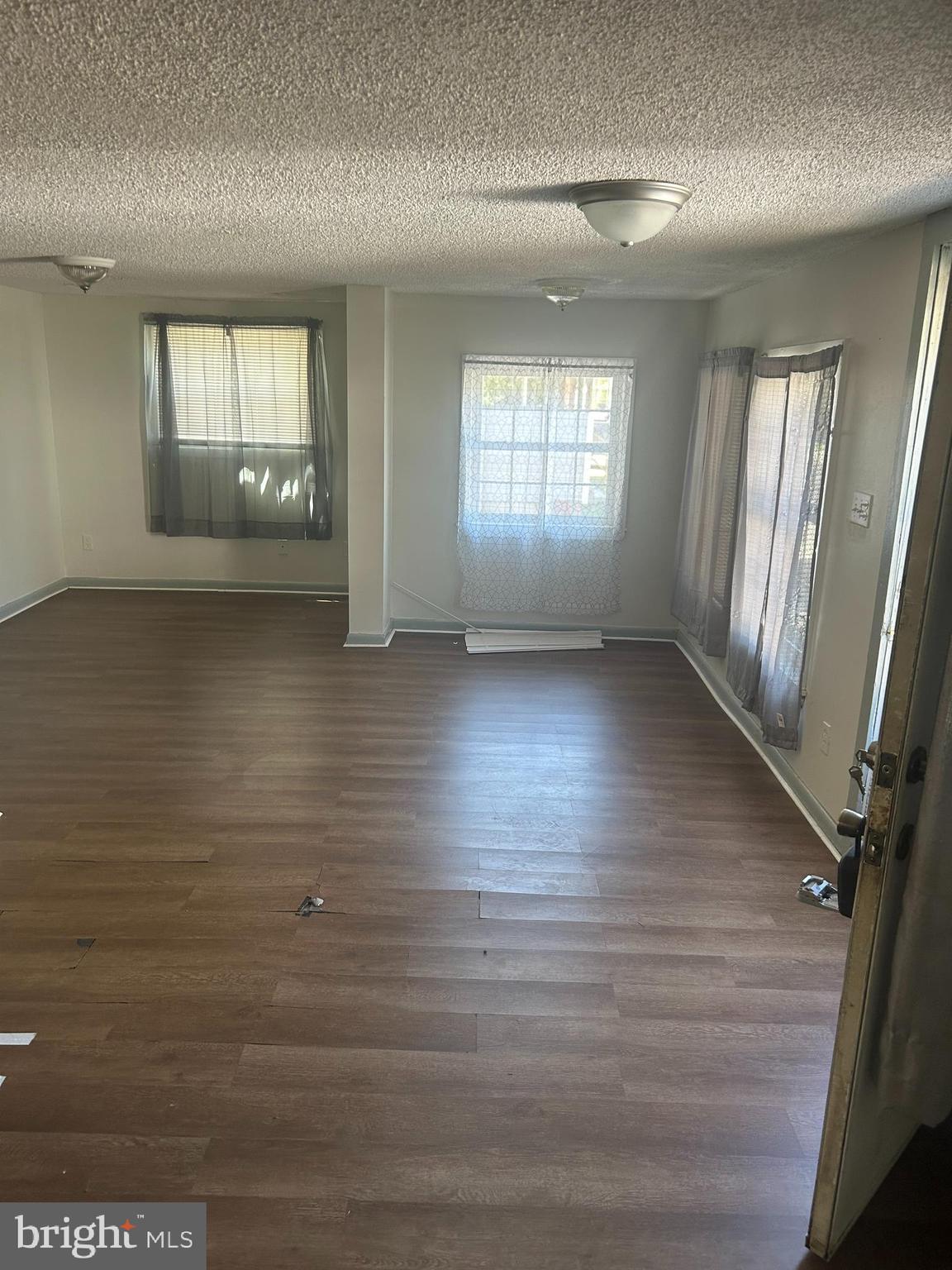 139 2nd Street Salisbury, MD 21801 - Photo 13 of 14 an empty room with wooden floor and windows