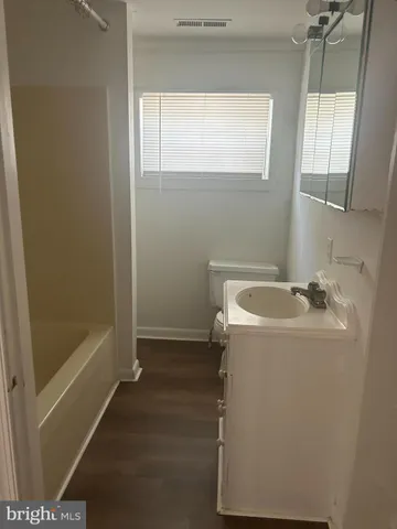 a bathroom with a sink and tub