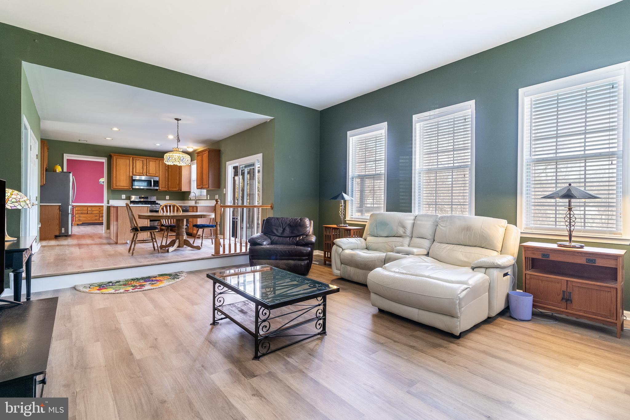 5815 Mill Branch Road Huntingtown, MD 20639 - Photo 21 of 47 a living room with furniture and a large window