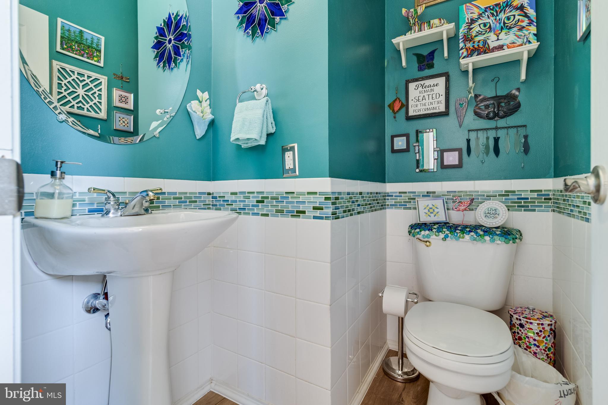 5815 Mill Branch Road Huntingtown, MD 20639 - Photo 23 of 47 a bathroom with a sink mirror and toilet
