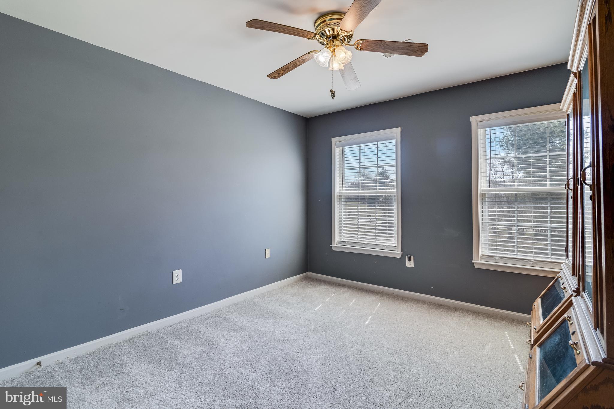 5815 Mill Branch Road Huntingtown, MD 20639 - Photo 25 of 47 a view of a livingroom with a ceiling fan and window