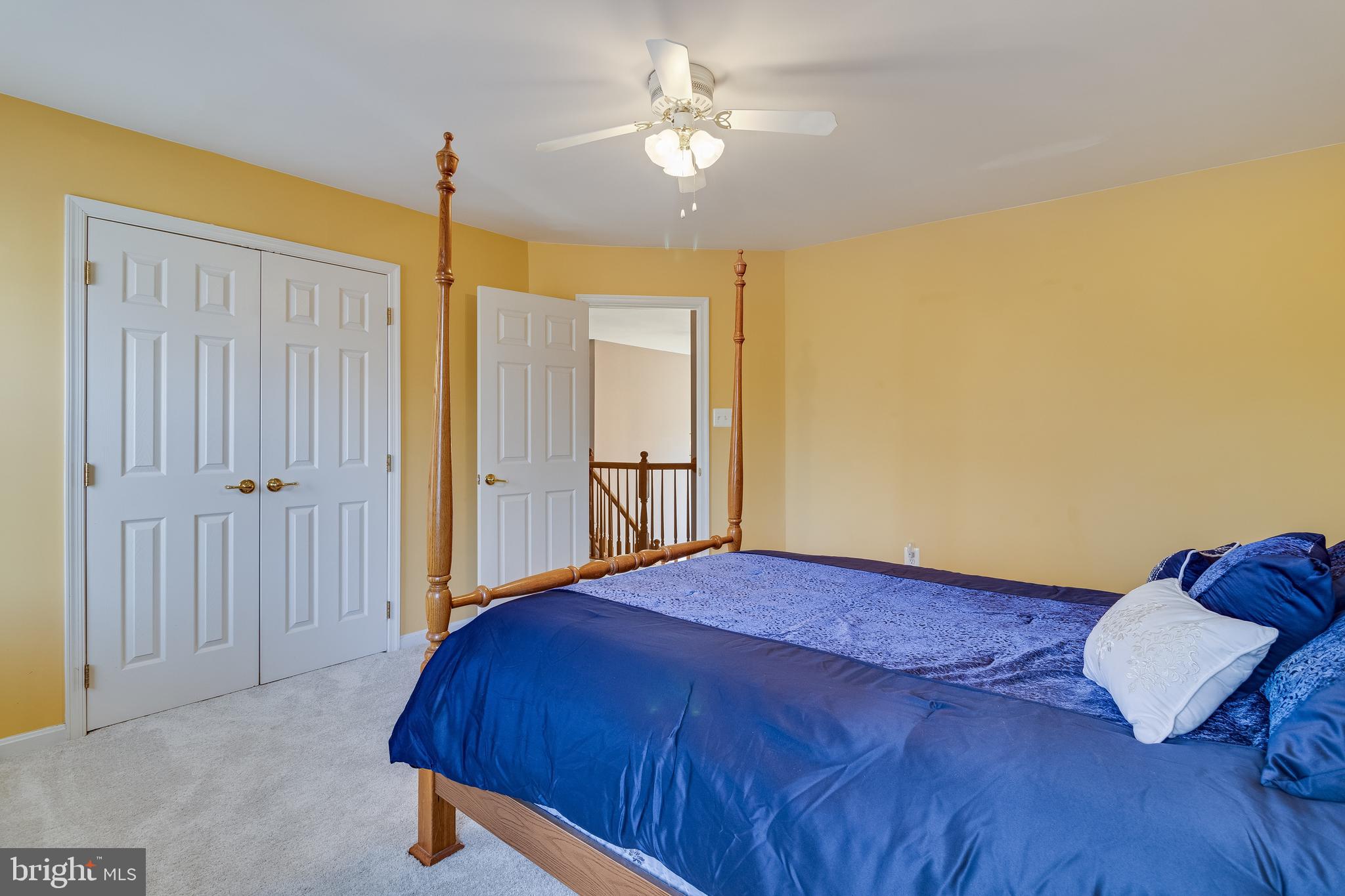 5815 Mill Branch Road Huntingtown, MD 20639 - Photo 36 of 47 a bedroom with a bed and a chandelier