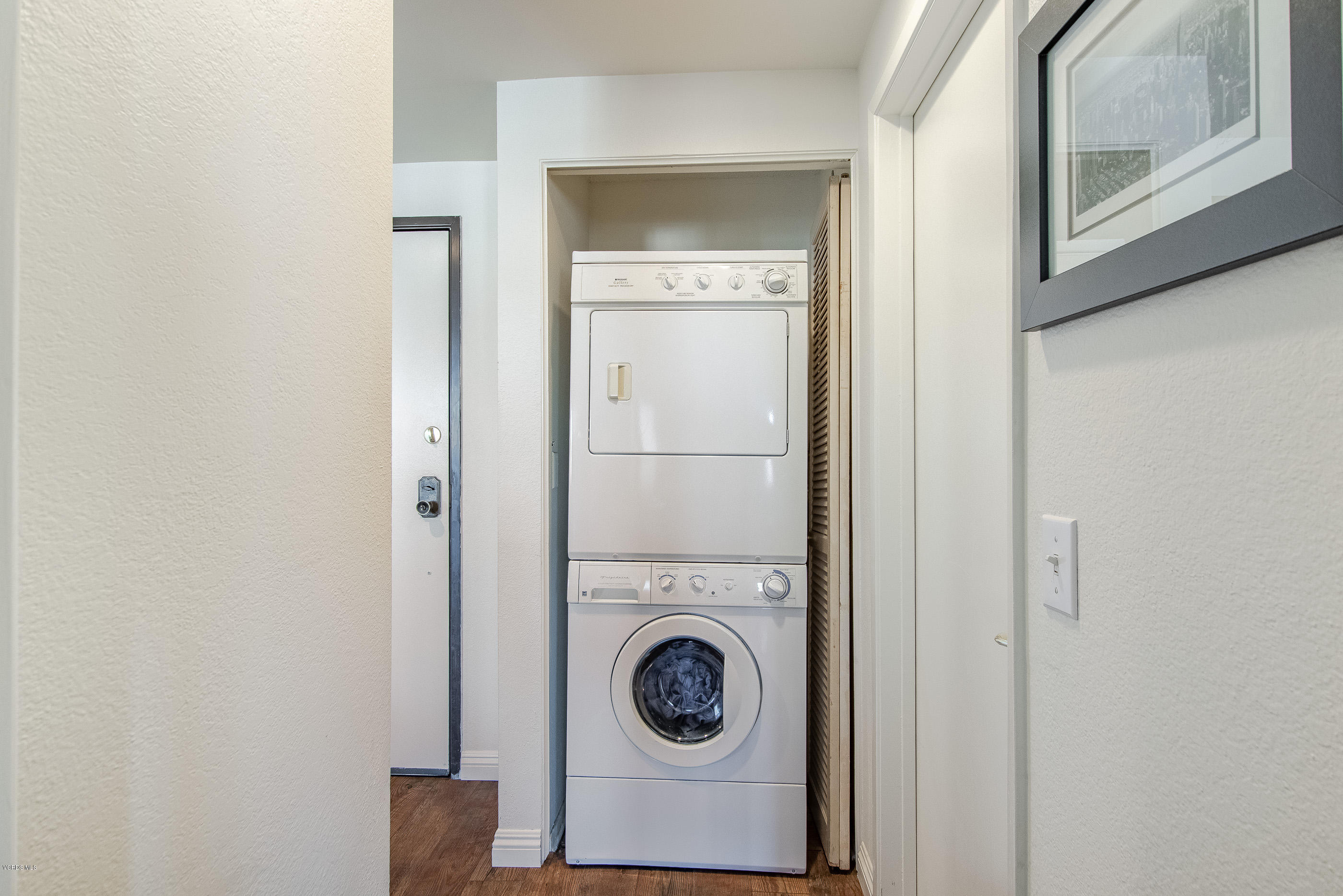 17914 West Magnolia Boulevard, Unit 316 Encino, CA 91316 - Photo 16 of 21 a utility room with dryer and washer