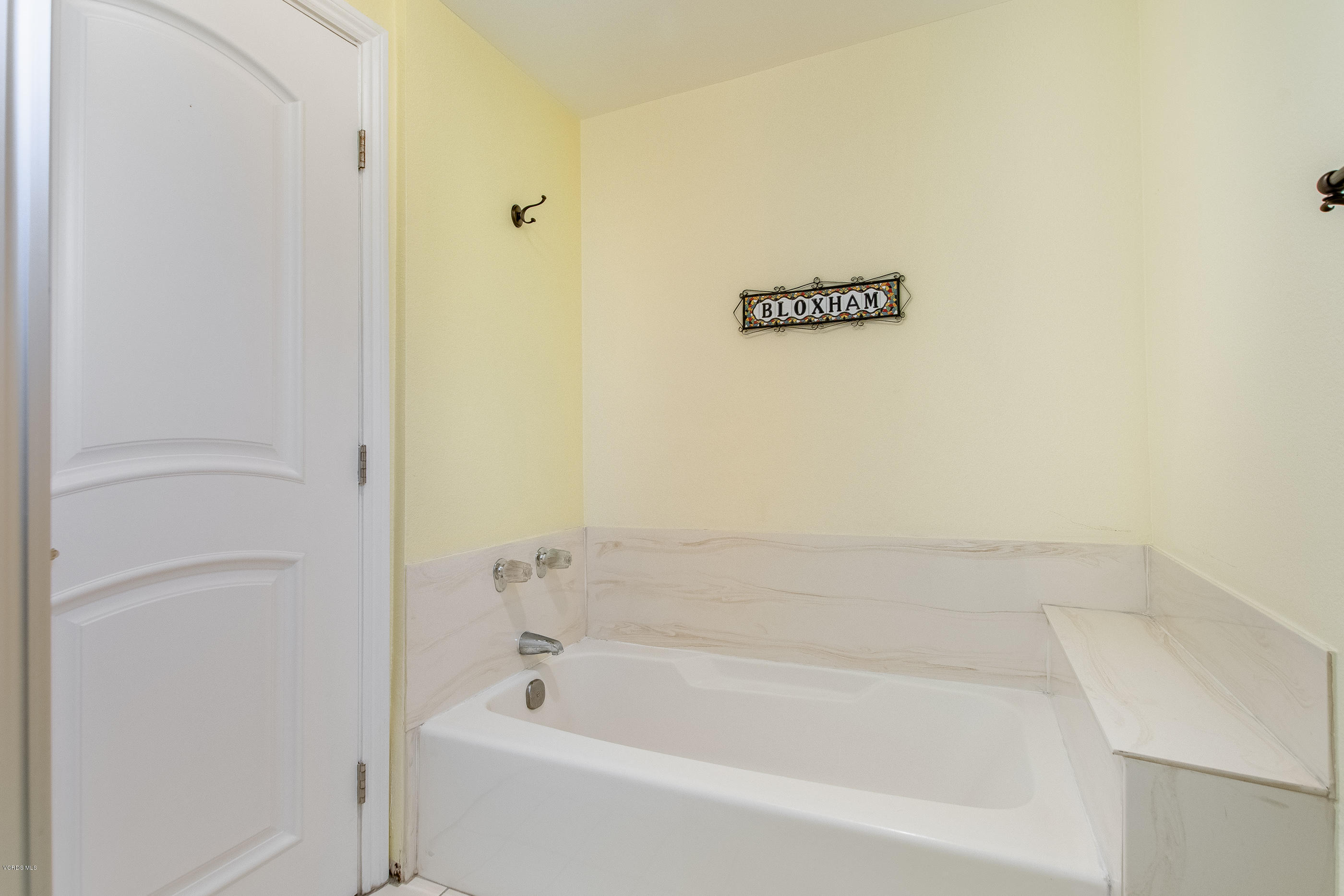17914 West Magnolia Boulevard, Unit 316 Encino, CA 91316 - Photo 17 of 21 a bathroom with a bathtub