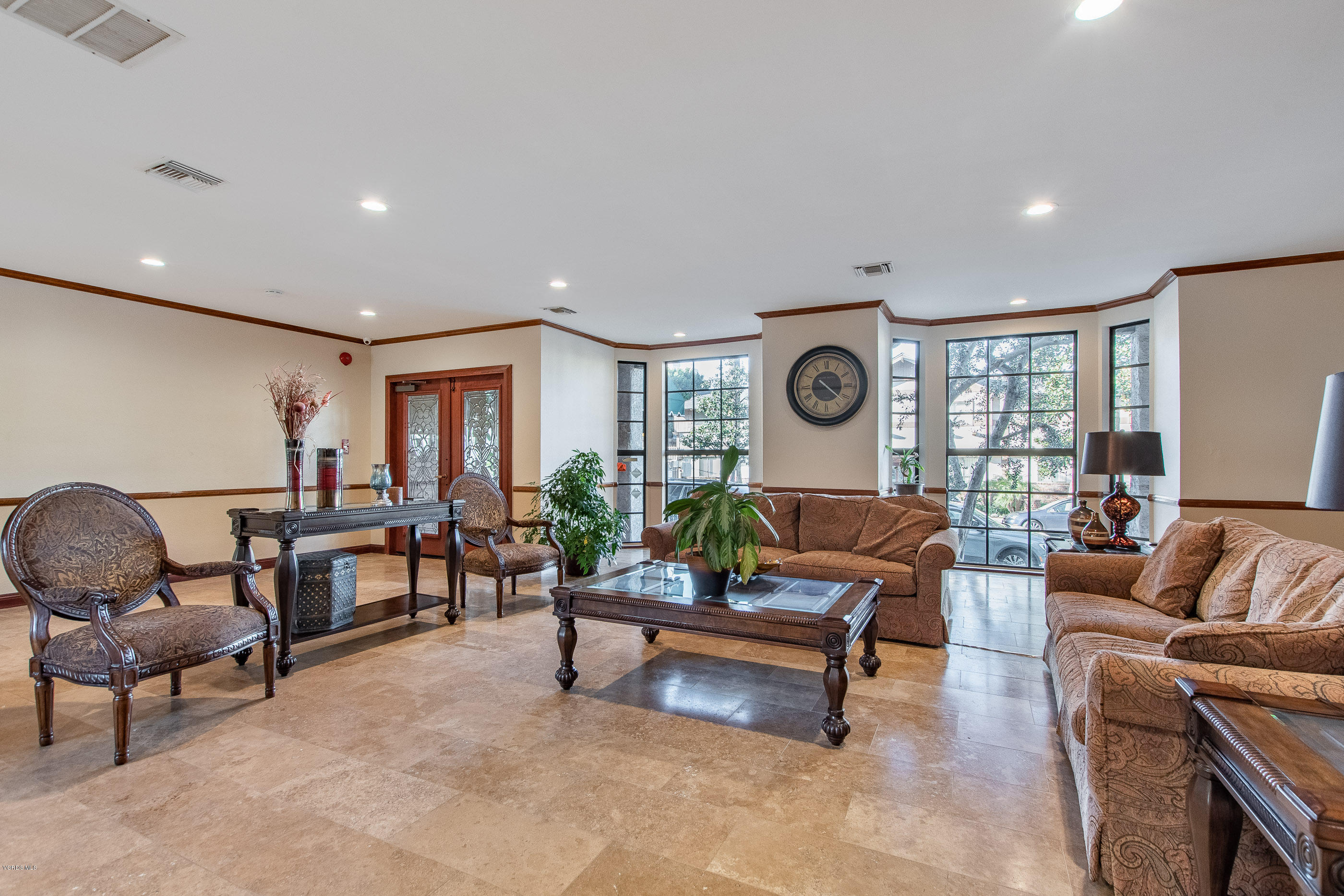 17914 West Magnolia Boulevard, Unit 316 Encino, CA 91316 - Photo 19 of 21 a living room with furniture and a large window