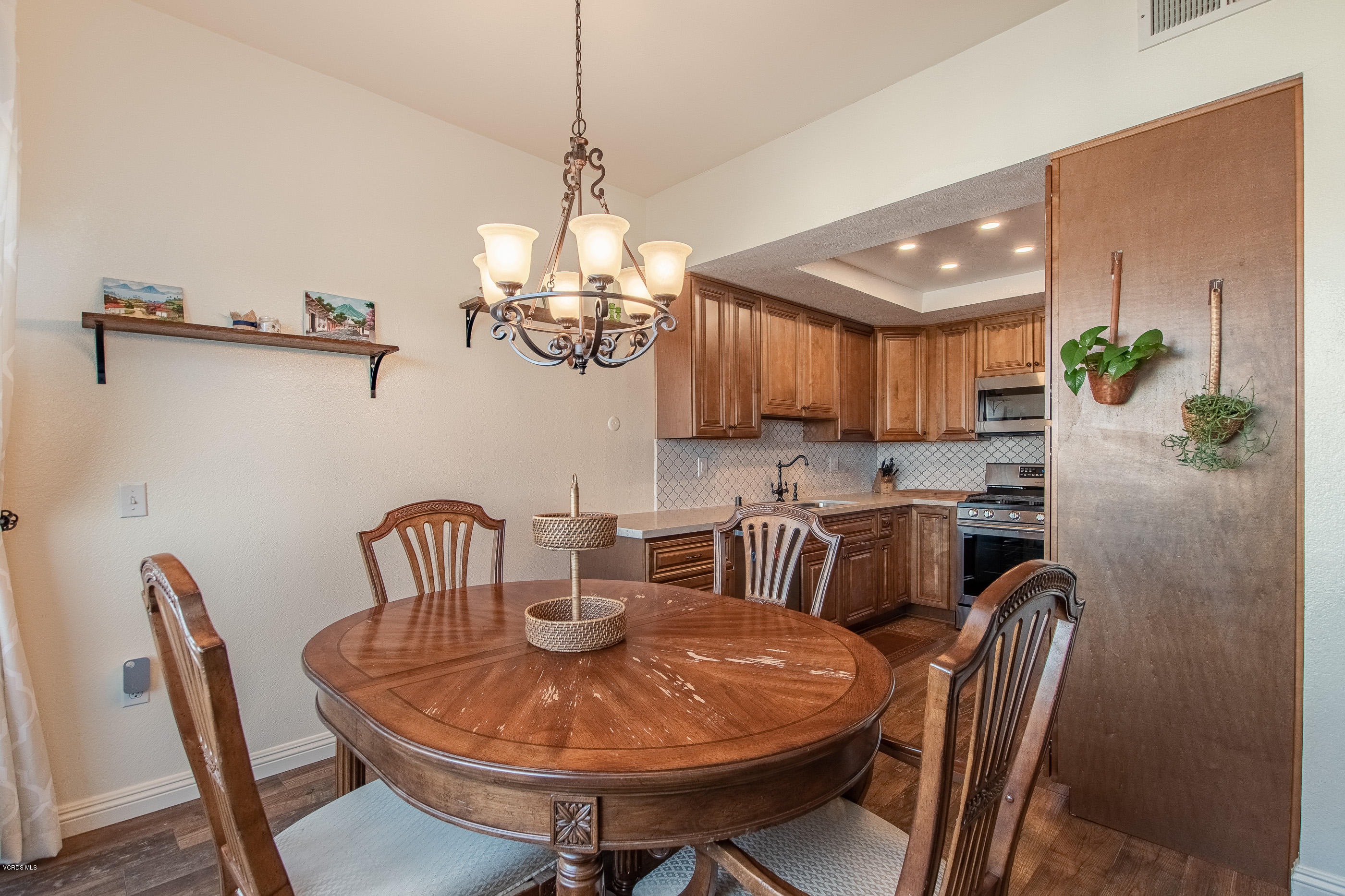 17914 West Magnolia Boulevard, Unit 316 Encino, CA 91316 - Photo 5 of 21 a view of a dining room with furniture