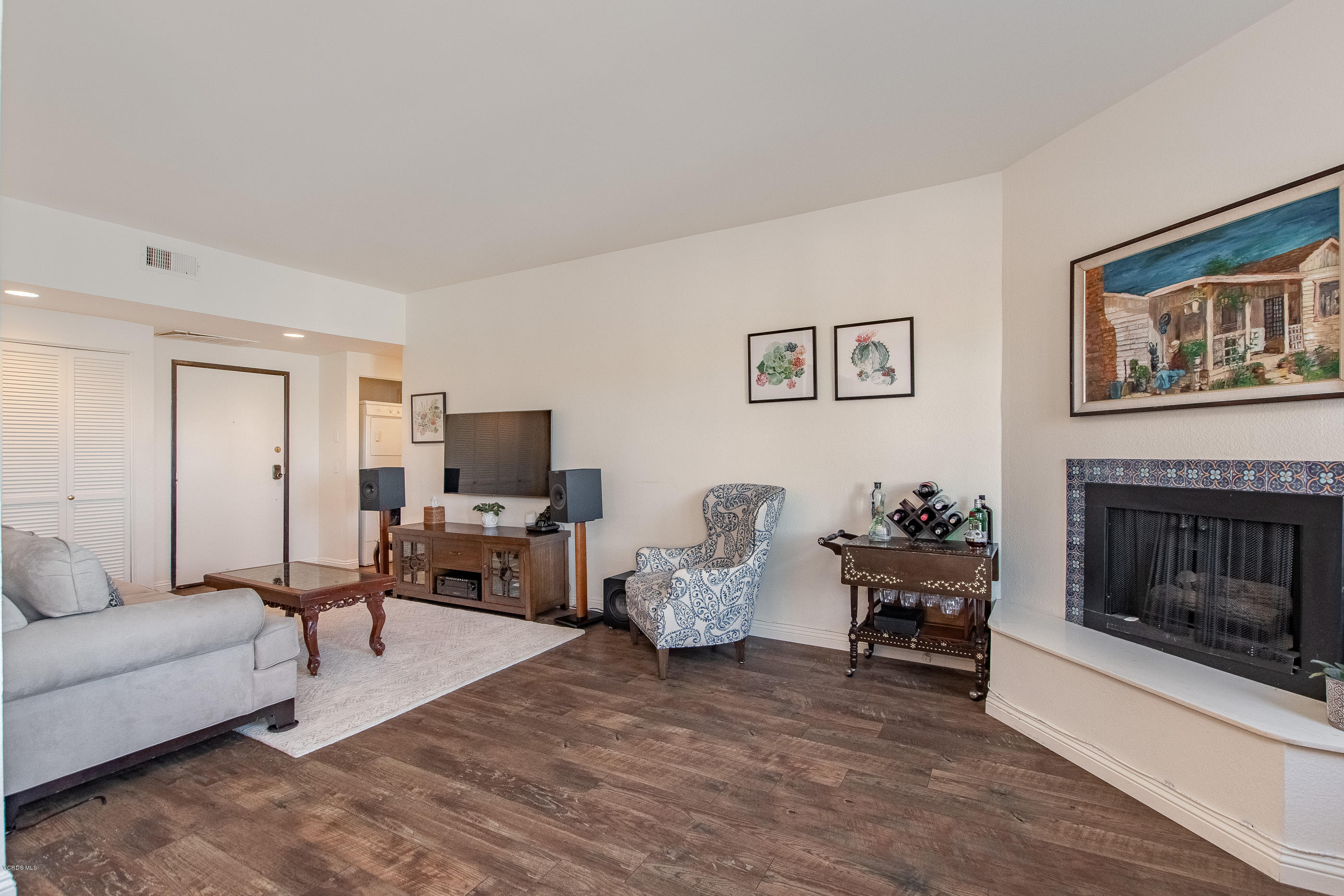 17914 West Magnolia Boulevard, Unit 316 Encino, CA 91316 - Photo 10 of 21 a living room with furniture and a fireplace