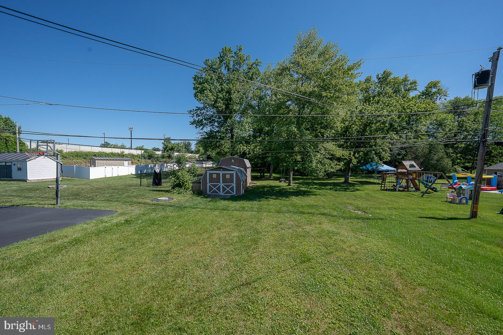 437 Rittenhouse Circle Havertown, PA 19083 - Photo 49 of 55 Spacious backyard with lush greenery.