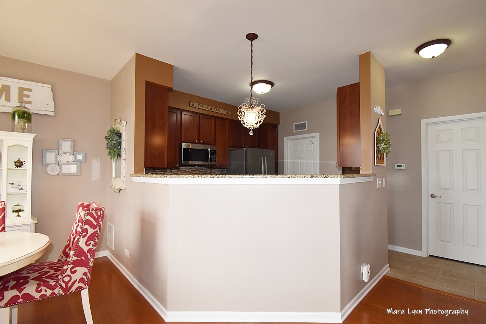 1986 West Cobblestone Road, Unit 1986 Romeoville, IL 60446 - Photo 11 of 36 a view of kitchen and dining room