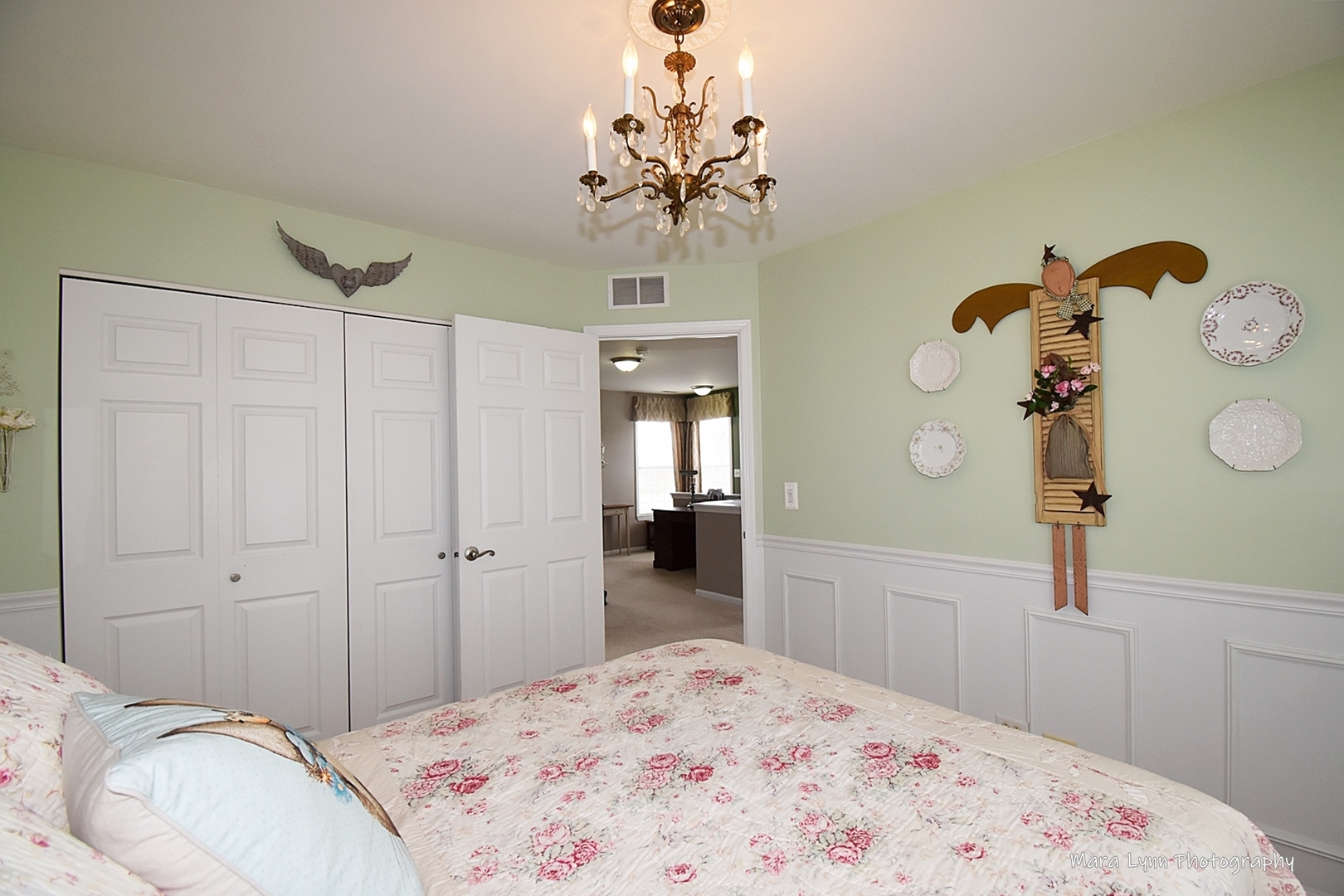 1986 West Cobblestone Road, Unit 1986 Romeoville, IL 60446 - Photo 28 of 36 a bedroom with a bed and a chandelier