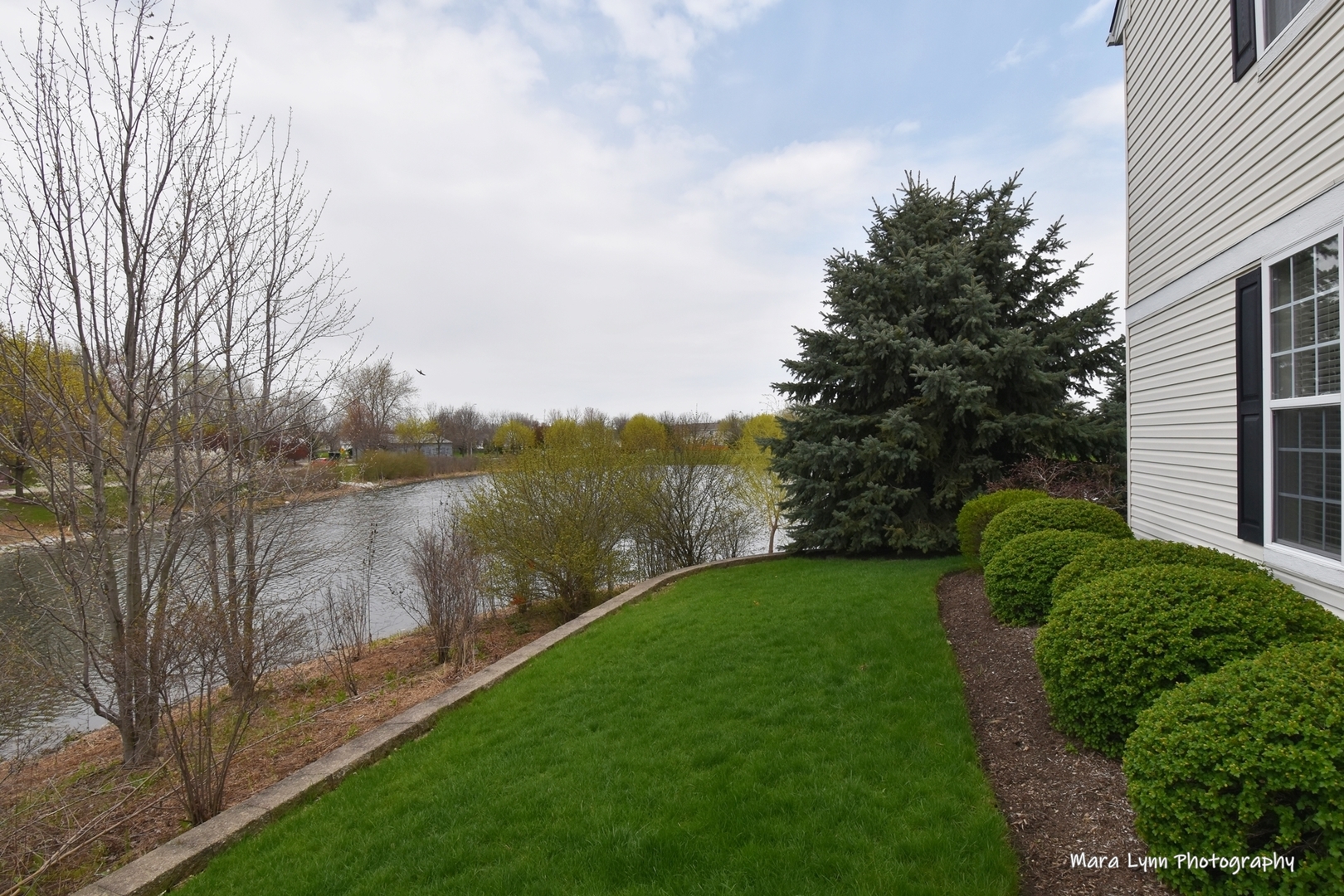 1986 West Cobblestone Road, Unit 1986 Romeoville, IL 60446 - Photo 31 of 36 a view of a lake from a yard