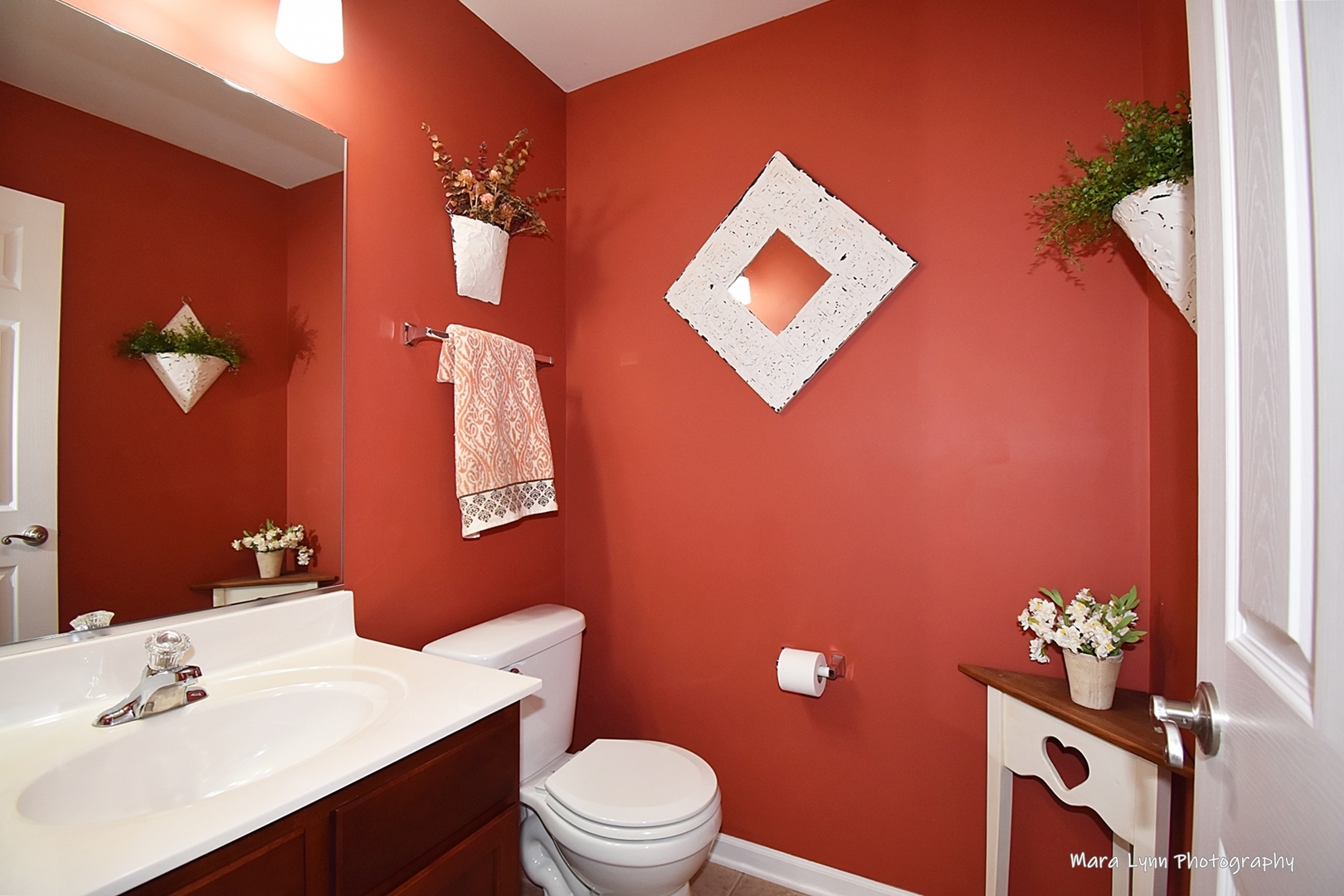 1986 West Cobblestone Road, Unit 1986 Romeoville, IL 60446 - Photo 5 of 36 a bathroom with a toilet sink and mirror