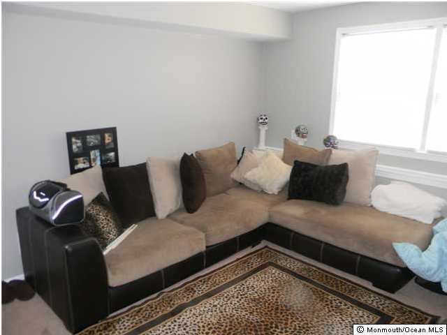 12 Buxton Road Jackson, NJ 08527 - Photo 3 of 7 a living room with furniture and a rug