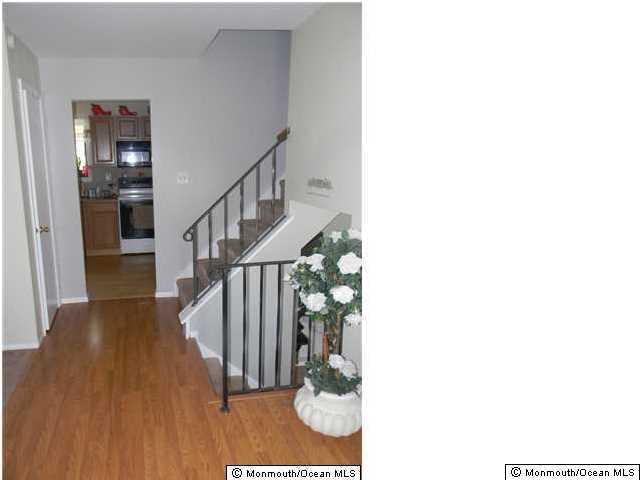 12 Buxton Road Jackson, NJ 08527 - Photo 5 of 7 a view of entryway and hall with wooden floor