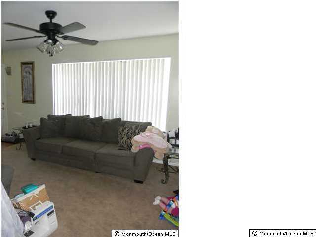 12 Buxton Road Jackson, NJ 08527 - Photo 6 of 7 a living room with furniture and a window