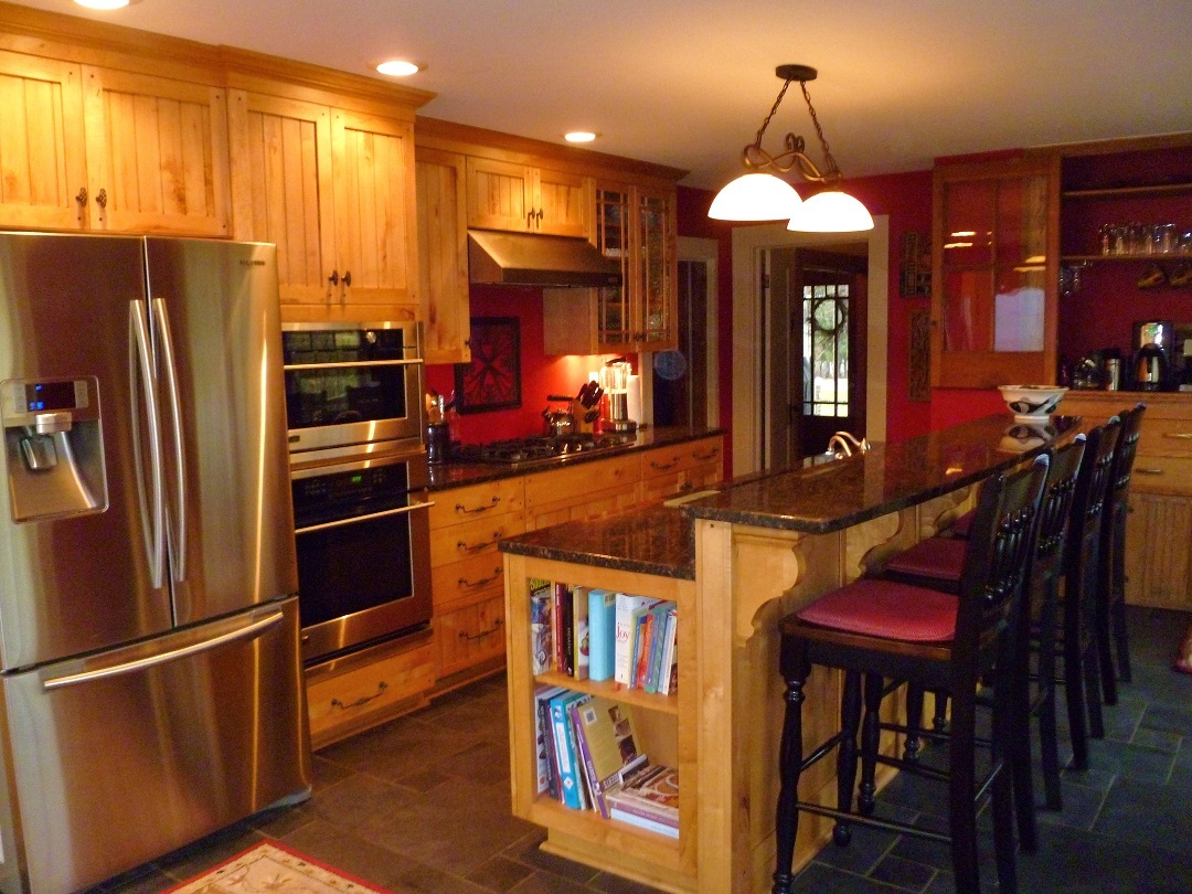3388 Webster Road Blue Ridge, VA 24064 - Photo 14 of 40 a kitchen with stainless steel appliances granite countertop a refrigerator a oven a dining table and chairs with wooden floor