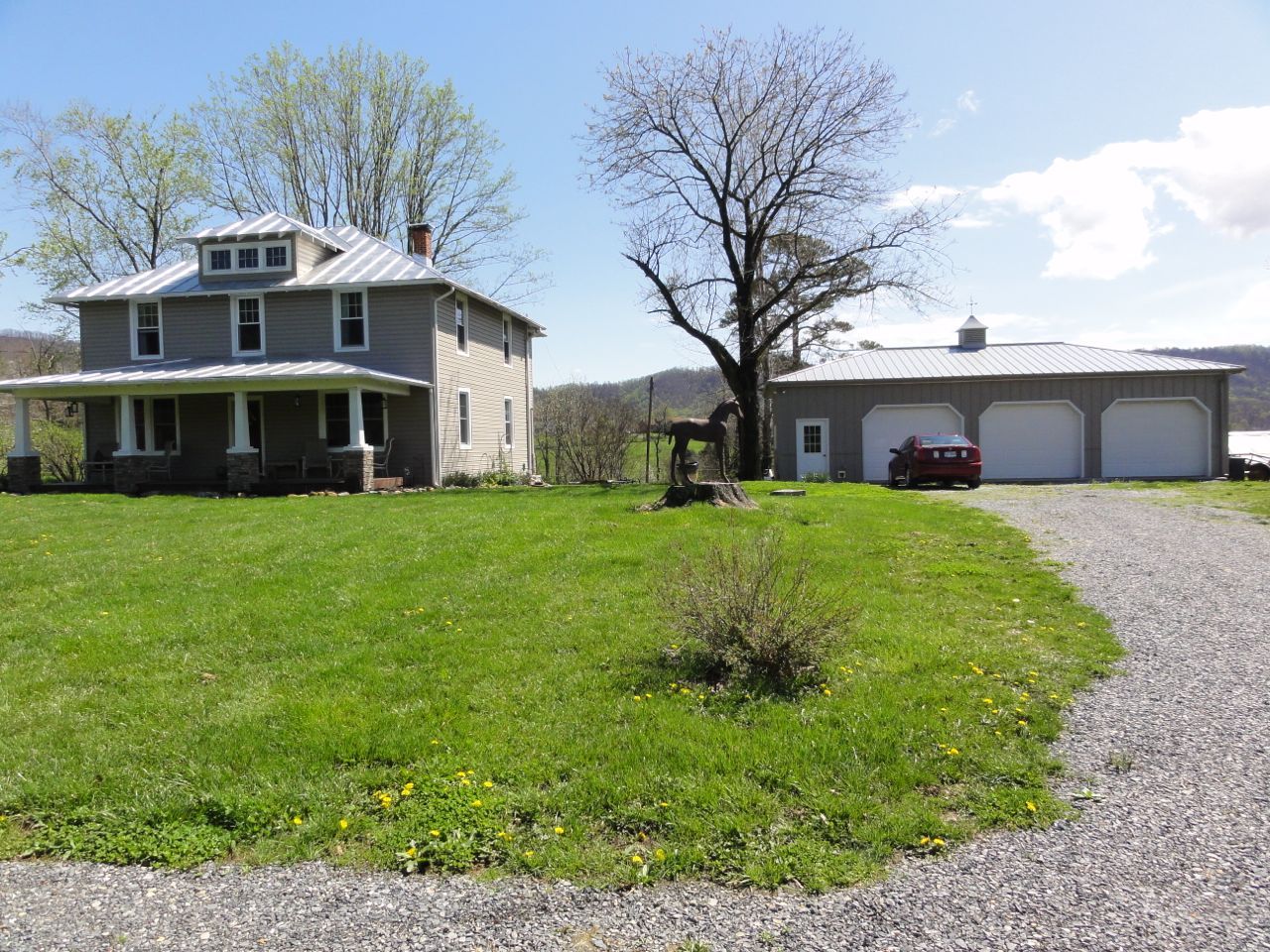 3388 Webster Road Blue Ridge, VA 24064 - Photo 36 of 40 a view of a white house next to a yard with big trees