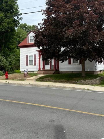 113 West Main Street, Unit 113 Ayer, MA 01432 - Photo 17 of 17 a view of a house with a large pool and a large tree