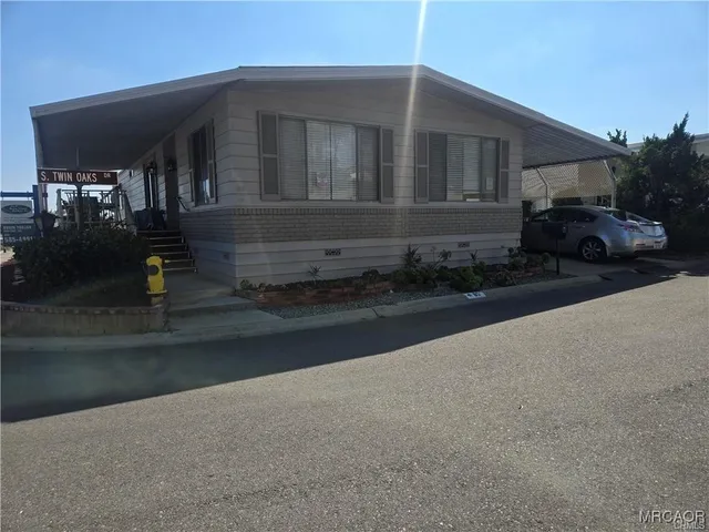 a view of a car park front of house