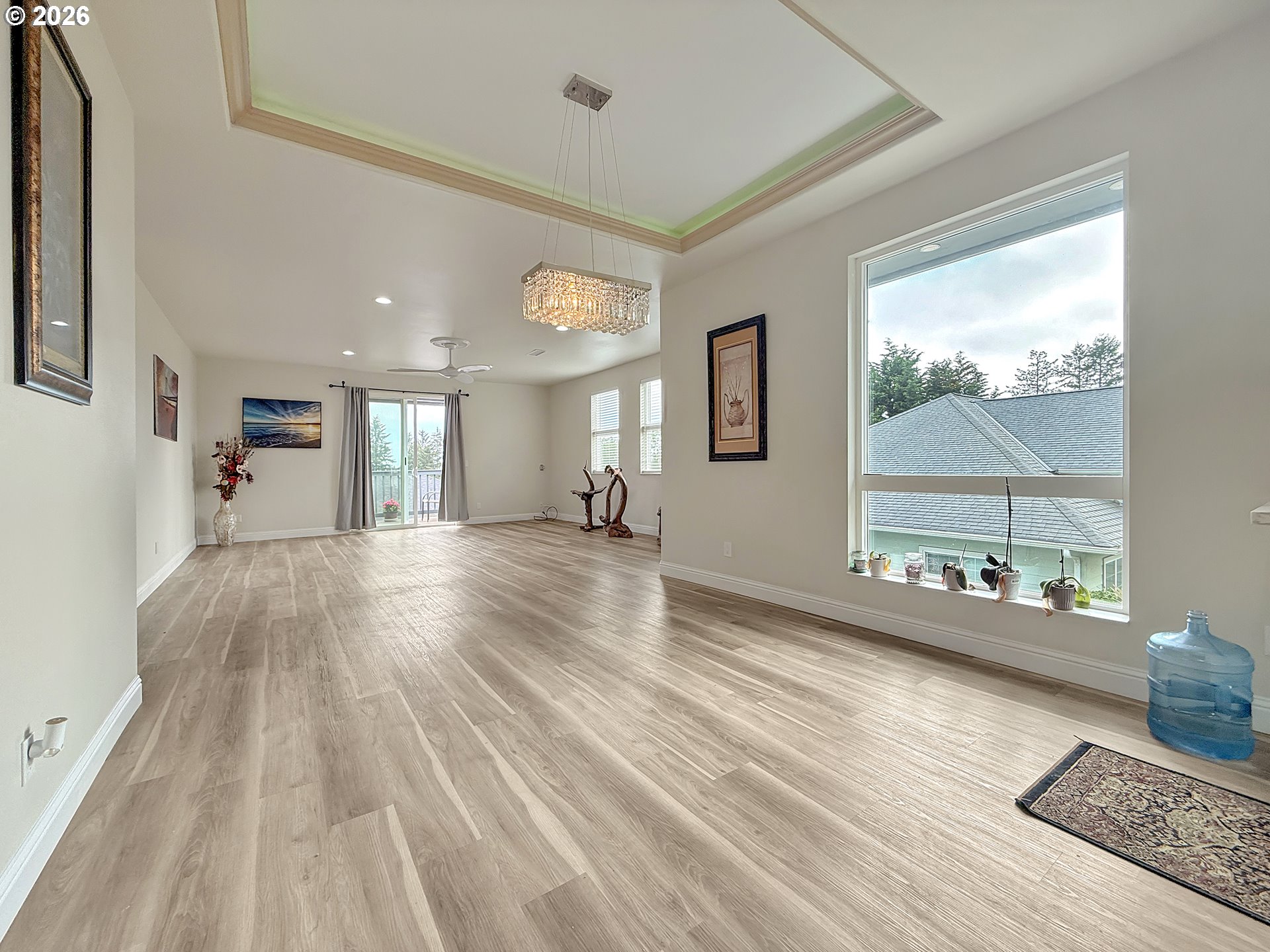 7175 Vista Ridge Drive Brookings, OR 97415 - Photo 11 of 43 a view of a living room and a large window with wooden floor