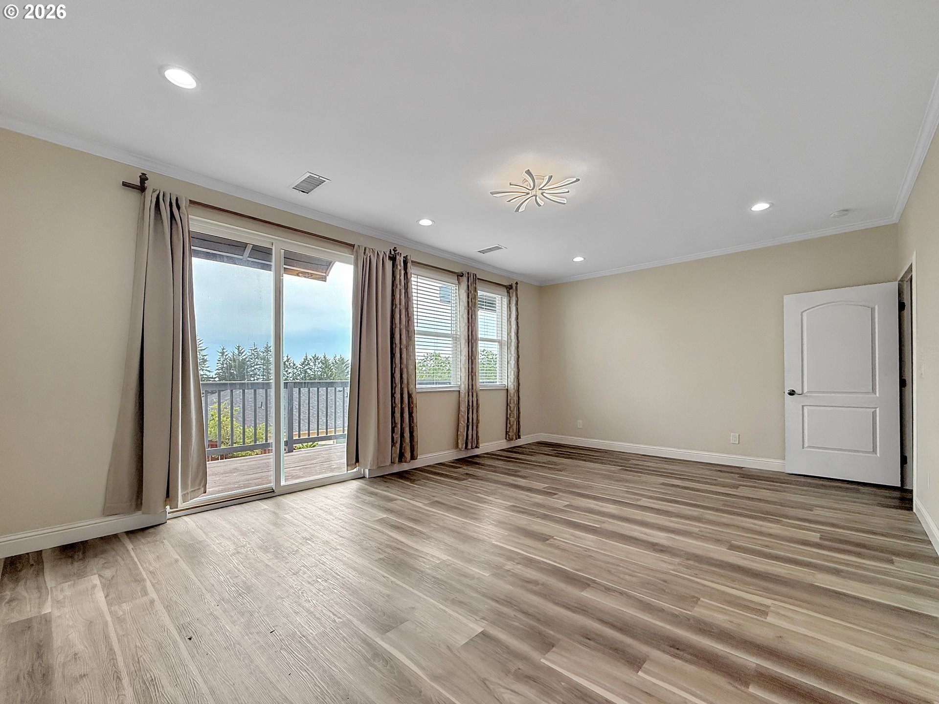 7175 Vista Ridge Drive Brookings, OR 97415 - Photo 13 of 43 a view of an empty room with wooden floor and a window