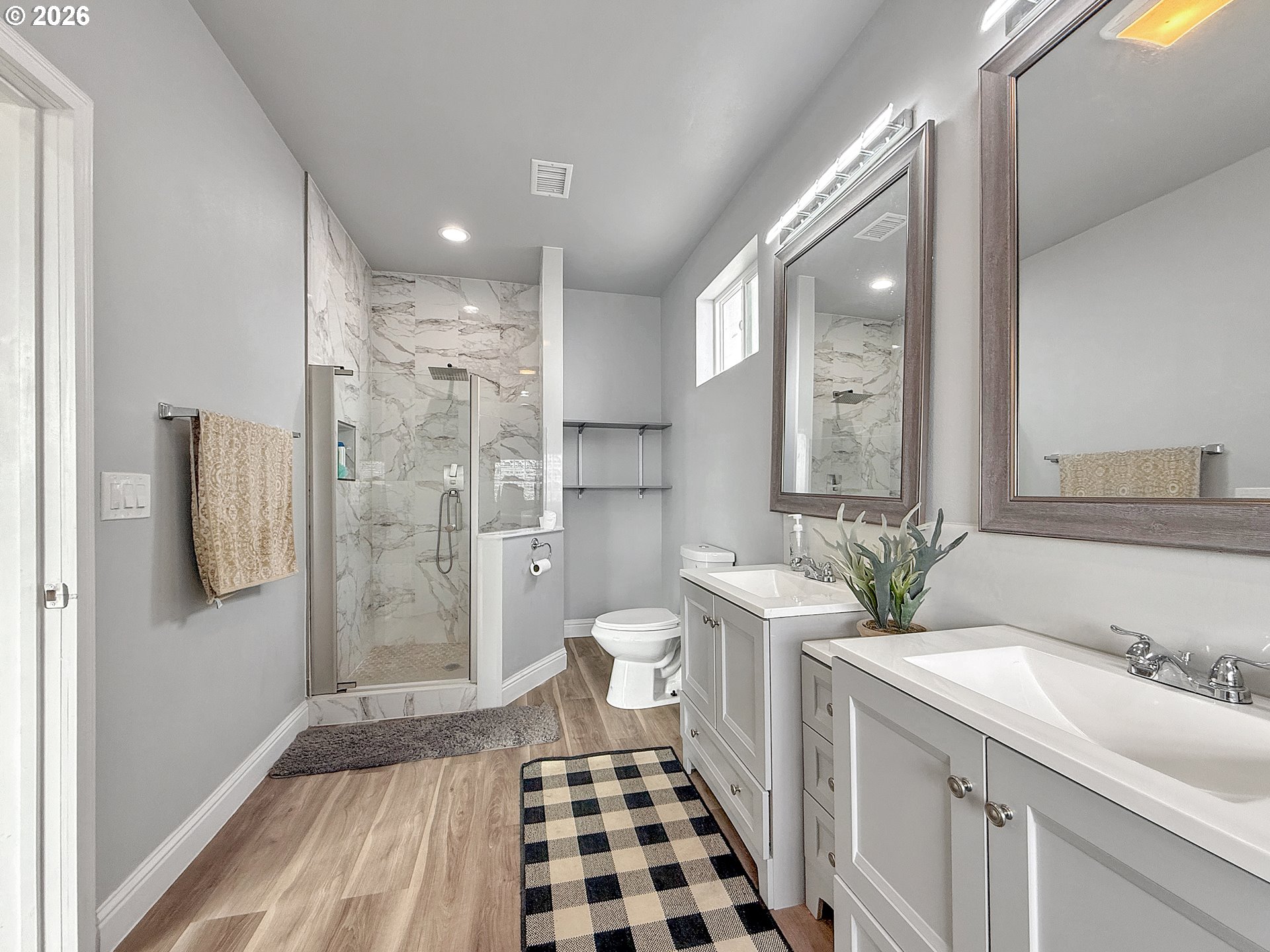 7175 Vista Ridge Drive Brookings, OR 97415 - Photo 16 of 43 a bathroom with a double vanity sink toilet and shower