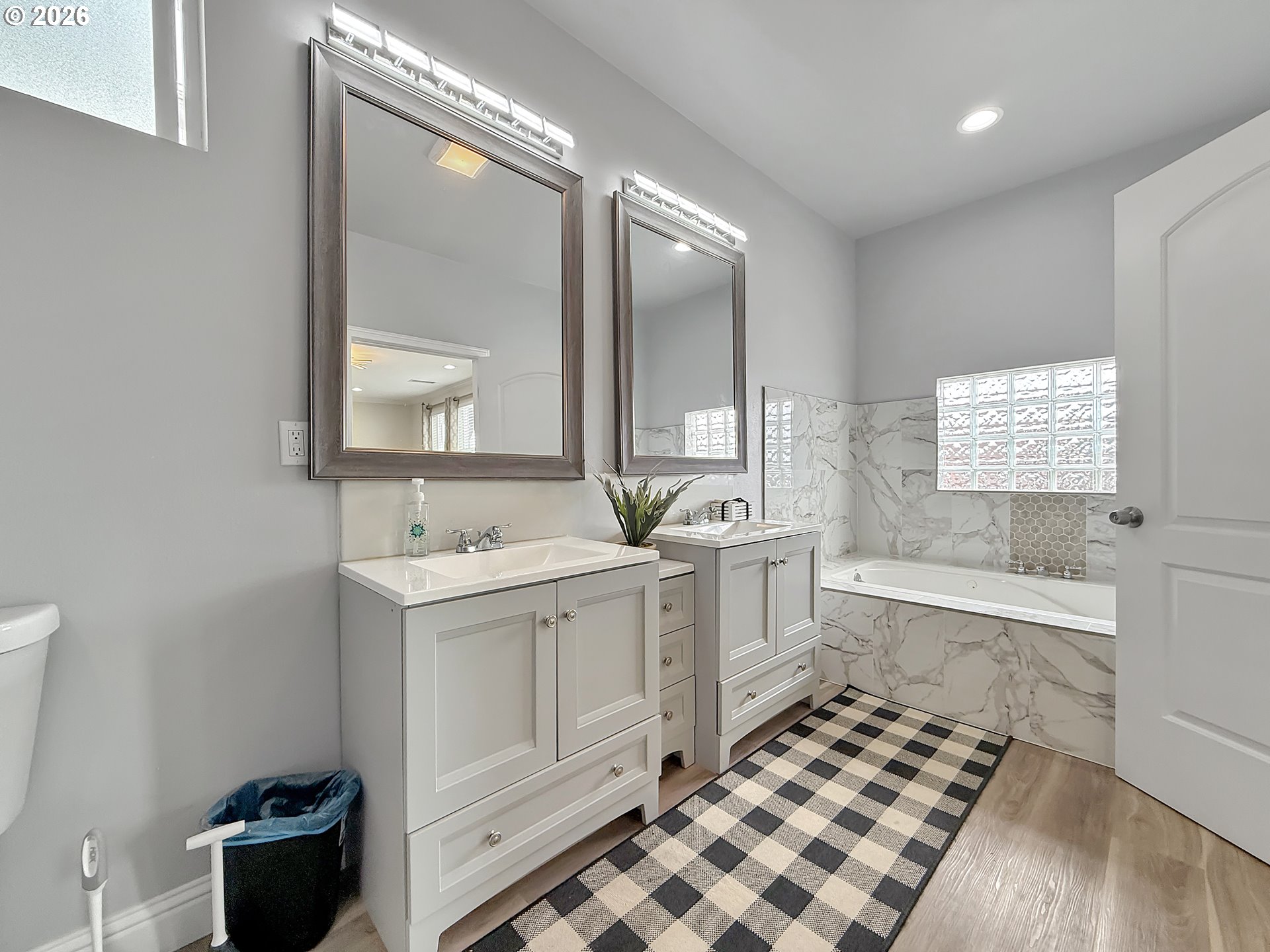 7175 Vista Ridge Drive Brookings, OR 97415 - Photo 17 of 43 a bathroom with a sink a toilet a mirror and vanity