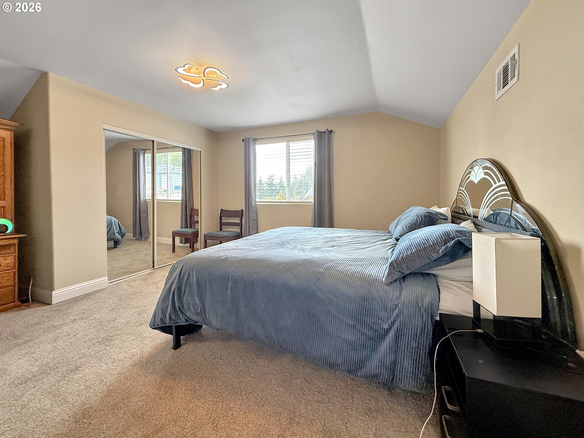 7175 Vista Ridge Drive Brookings, OR 97415 - Photo 21 of 43 a bedroom with a bed and window