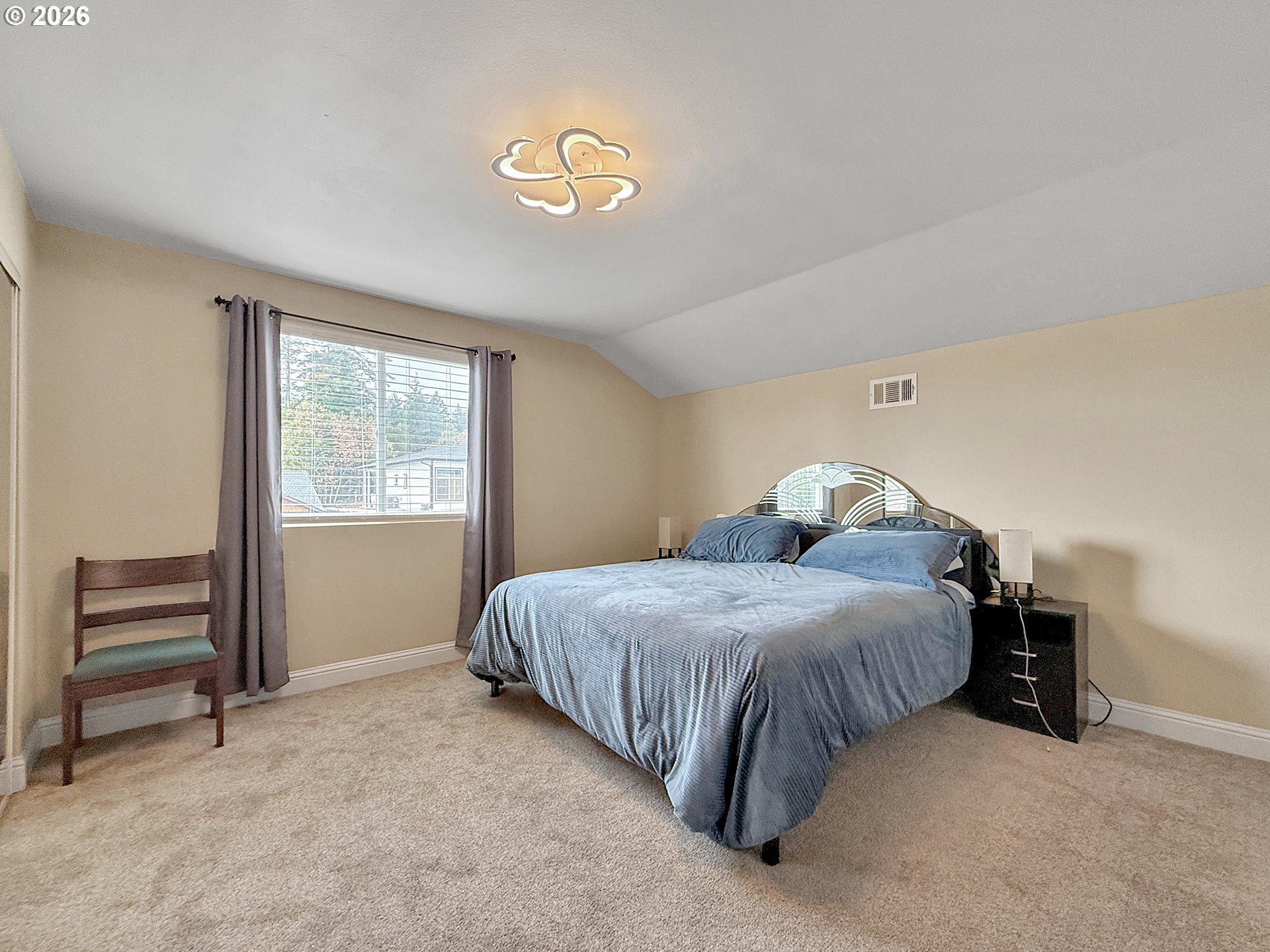 7175 Vista Ridge Drive Brookings, OR 97415 - Photo 22 of 43 a bedroom with a bed and a window